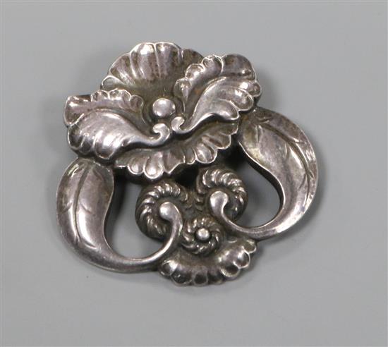 An early 20th century Danish Georg Jensen sterling silver stylised flowerhead brooch, no. 97,